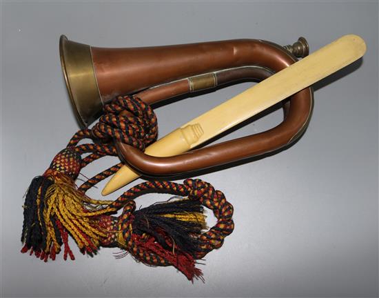 A faux ivory paper knife, a bugle and a canteen box